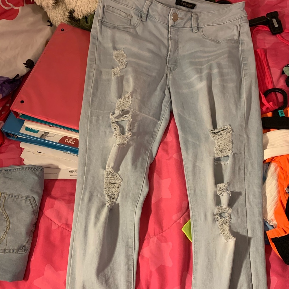 Light blue washed out colored ripped Jeans